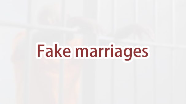 What are the consequences of engaging in a fake green card marriage?